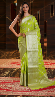 The Handlooms light aqua blue pure linen Banarasi saree with silver zari border and paisley motifs.