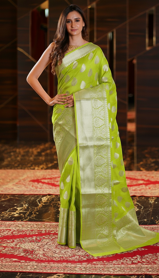 The Handlooms light aqua blue pure linen Banarasi saree with silver zari border and paisley motifs.